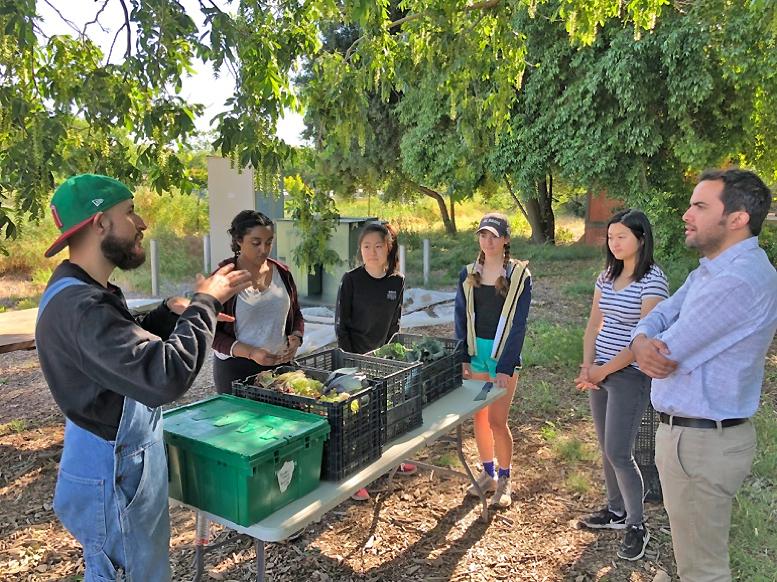 Photo of Yanez and workers at UC Davis student farm.