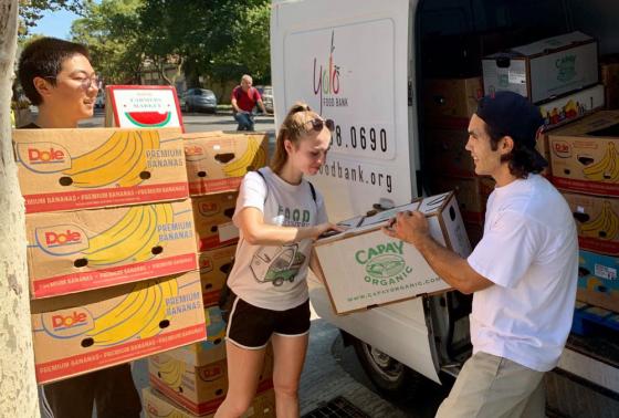 Food Recovery Network volunteers unload leftover food from the Davis Farmers Market