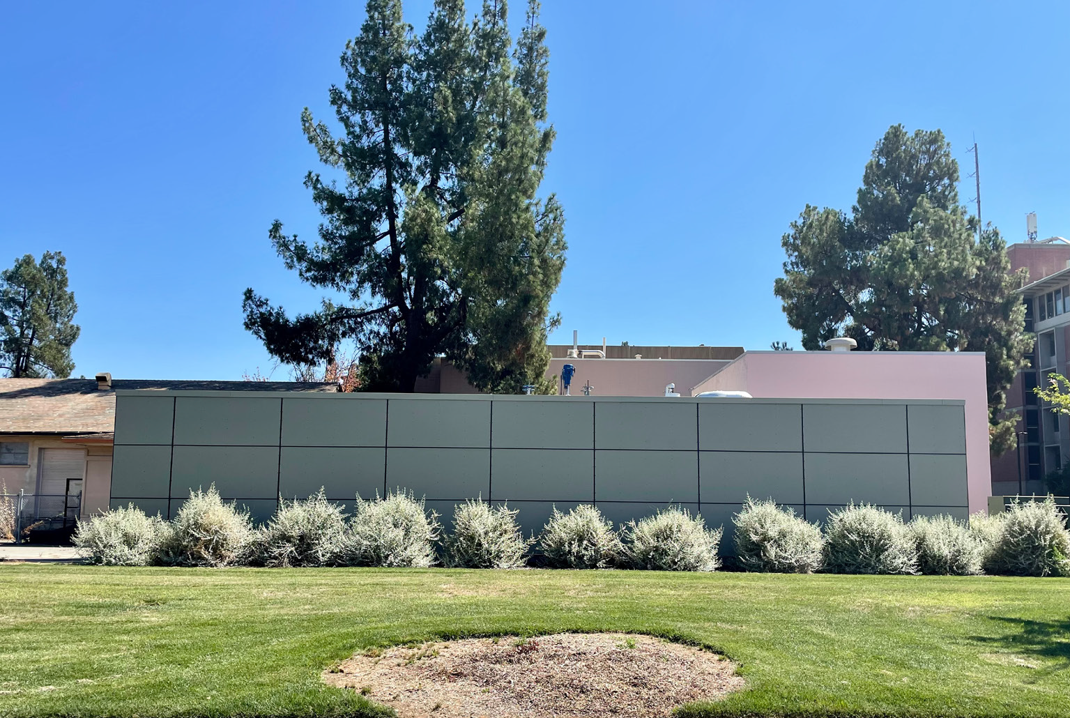 Image of a non-descript building on the UC Davis campus that houses equip vital to the Big Shift, a large-scale construction project essential to facilitating the campus's move away from fossil fuel use in its operations.