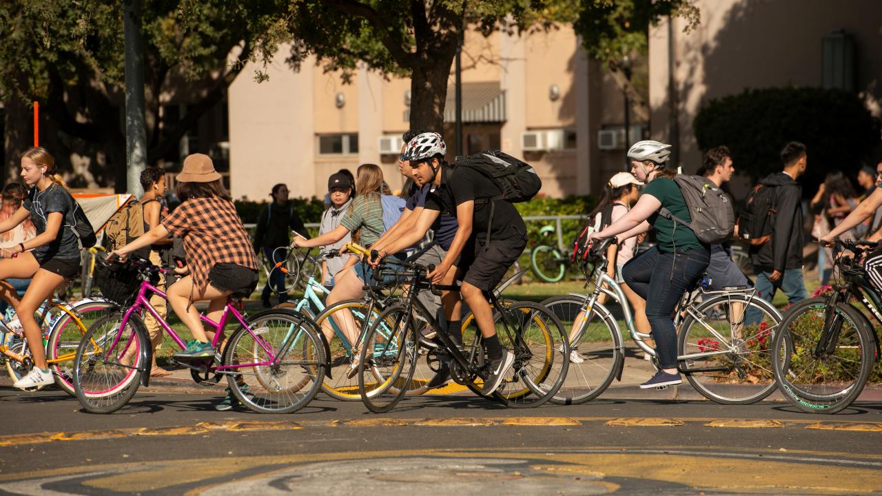 Image of students on bikes going around a bike circle.