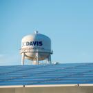 Image of solar arrays with UC Davis water tower in the background.