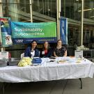 Three people sit at a table under a banner that reads Clinical Practice Council Sustainability Subcommittee