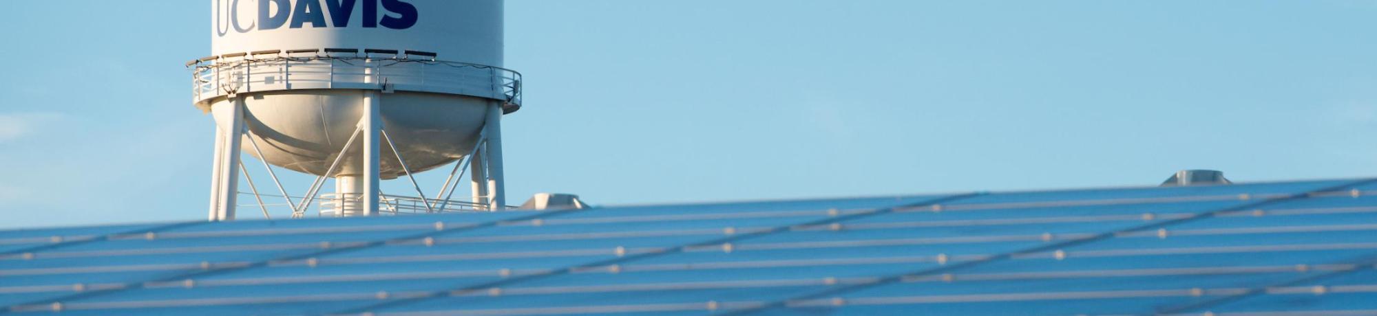 Image of solar arrays with UC Davis water tower in the background.